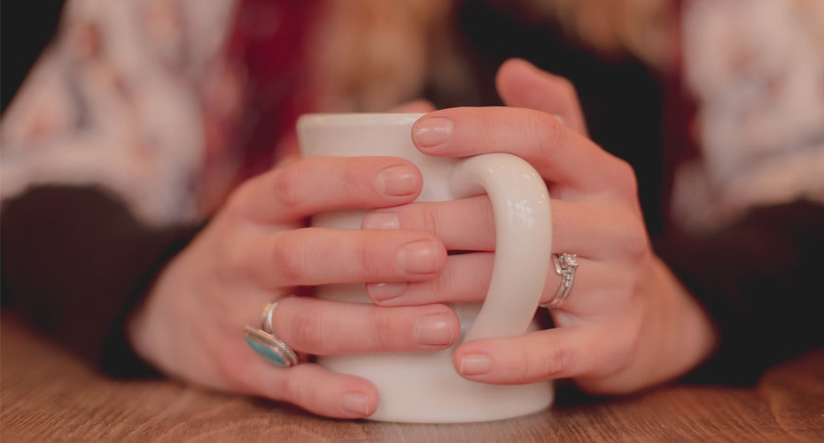 an image of a pair of hands holding a mug