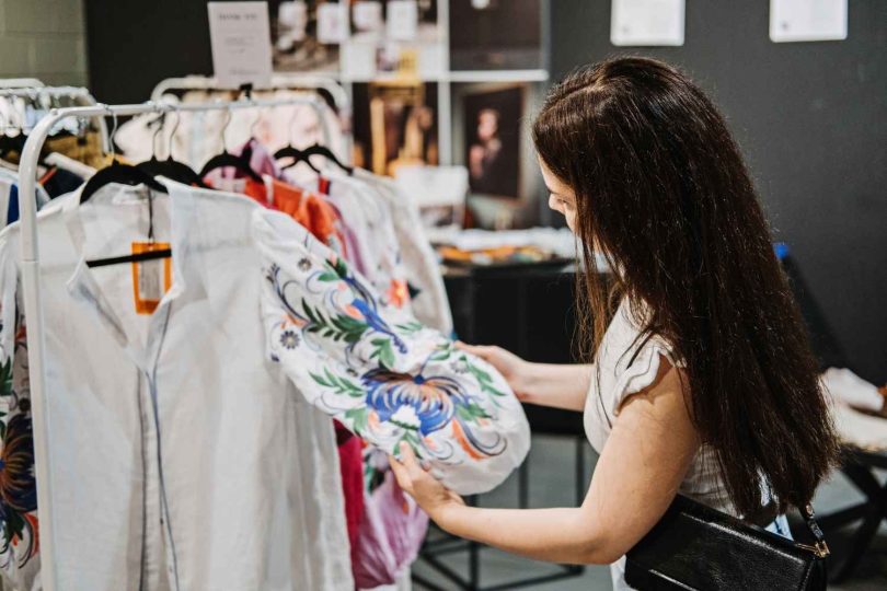 Young woman browsing clothes