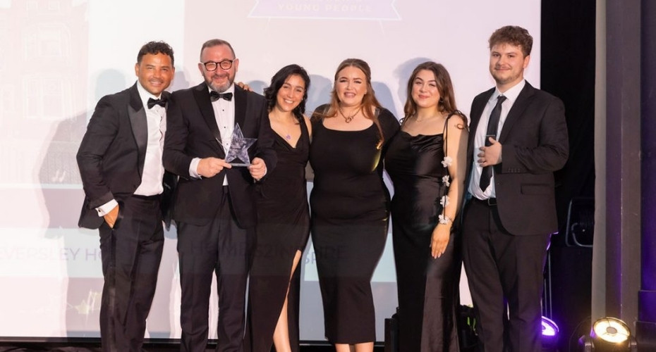 Eversley House Team photographed with an award from host Coronation Street actor Ryan Thomas.