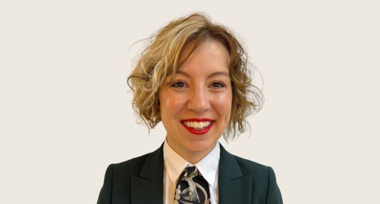 Woman smiling wearing business attire